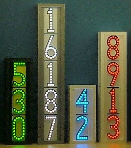 Group of 4 vertical LEDress lighted house numbers at night