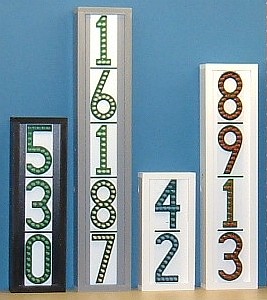Group of 4 vertical LEDress lighted house numbers, daytime